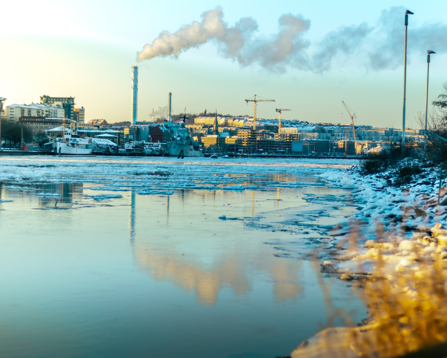 Polluted water with a factory in the background